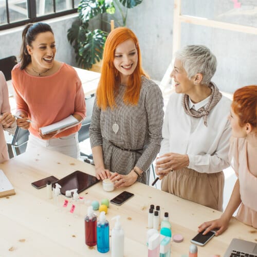 People discussing and testing products.